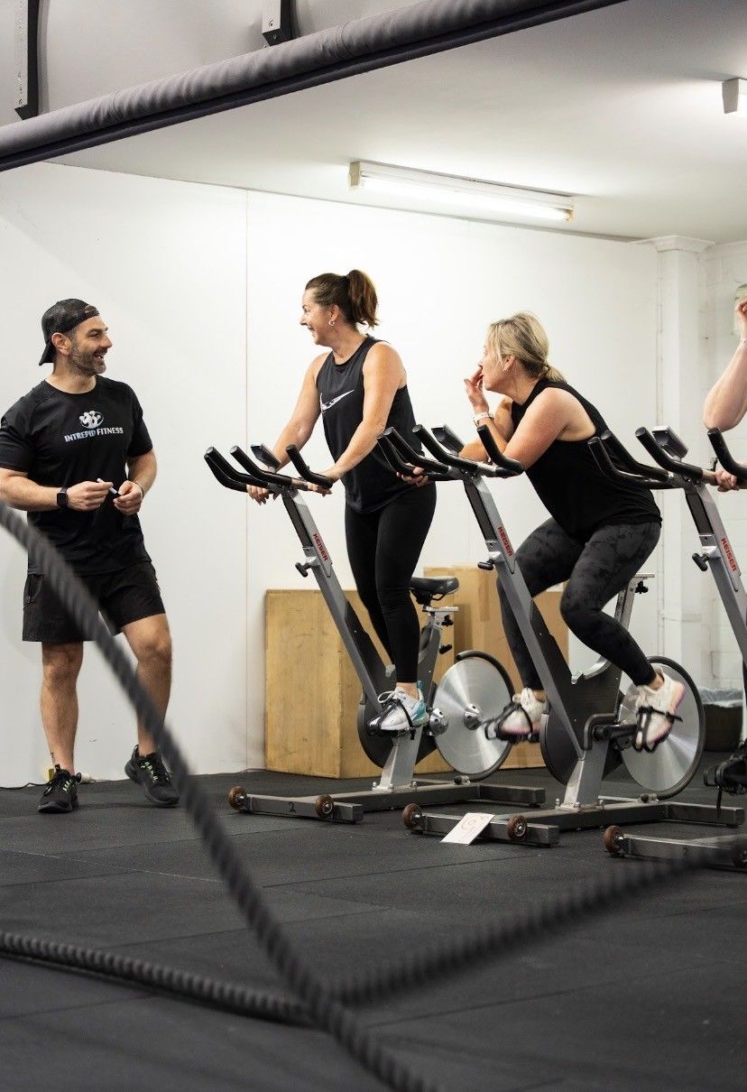 Youth members doing strength and conditioning with kettlebells and a sled at Intrepid Fitness