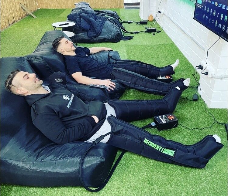Members resting and recovering between efforts at Intrepid Fitness