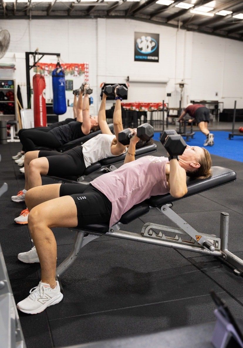 women doing weight training